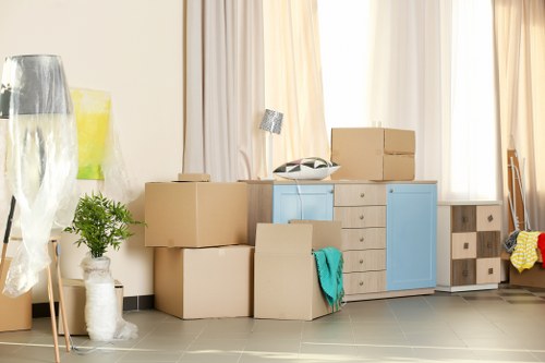 Student removals team planning a move in Dulwich with boxes and furniture