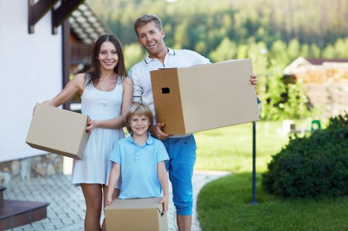 Careful unloading of boxes and furniture at a Dulwich home