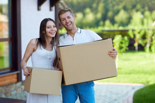 Careful unpacking of household items into a new room in Dulwich